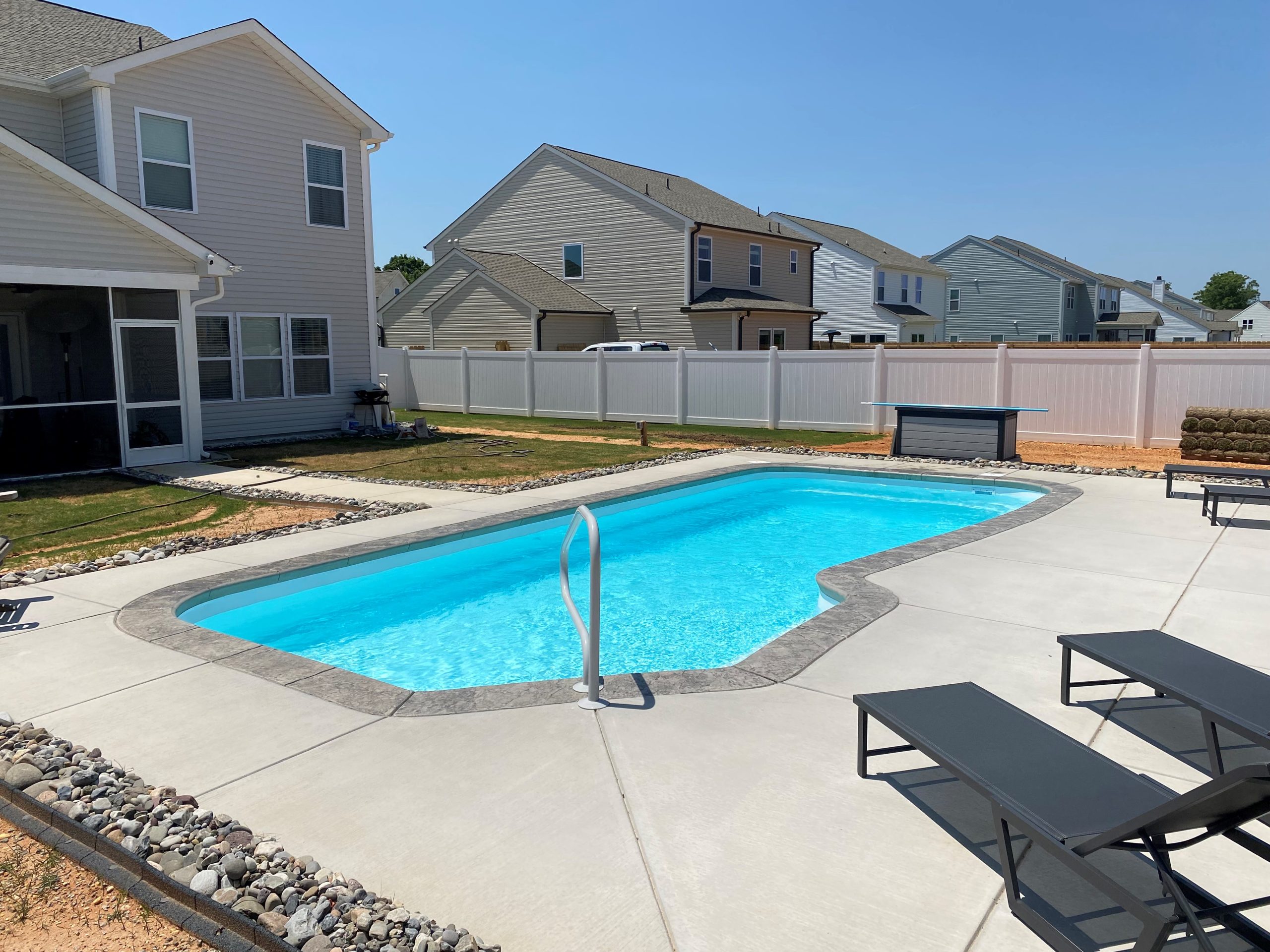 Brasilia fiberglass pool installed in a backyard