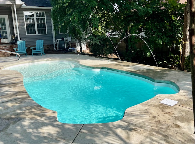 Fiberglass pool installed in a backyard