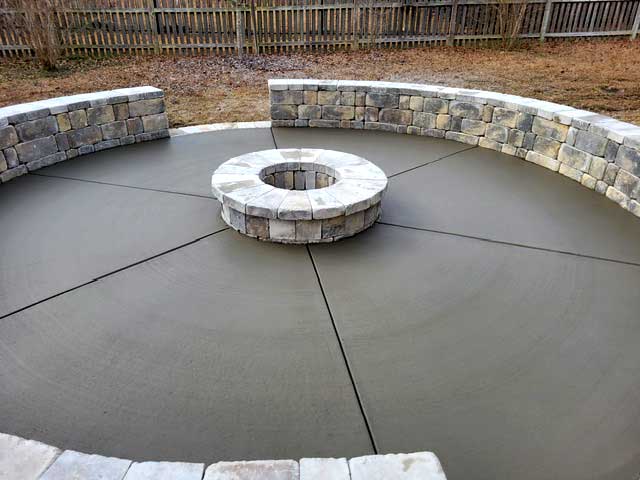 Outdoor fire pit installed next to pool