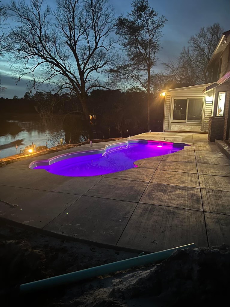 Fiberglass pool installed in a backyard