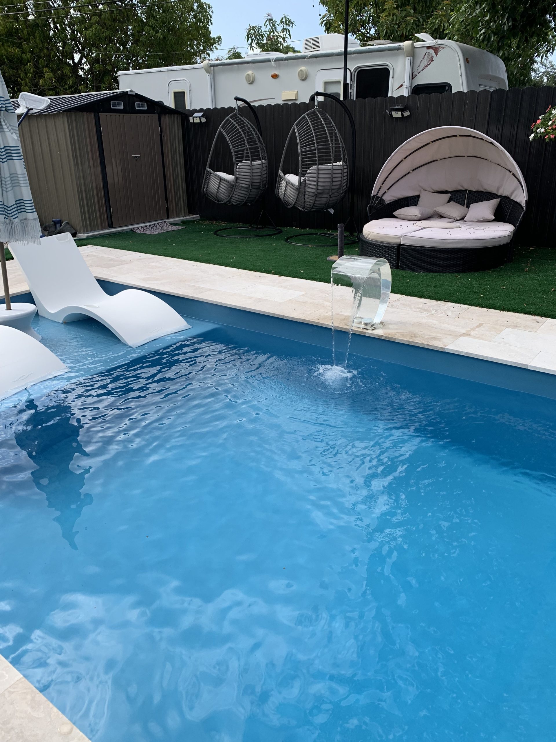 Fiberglass pool installed in a backyard