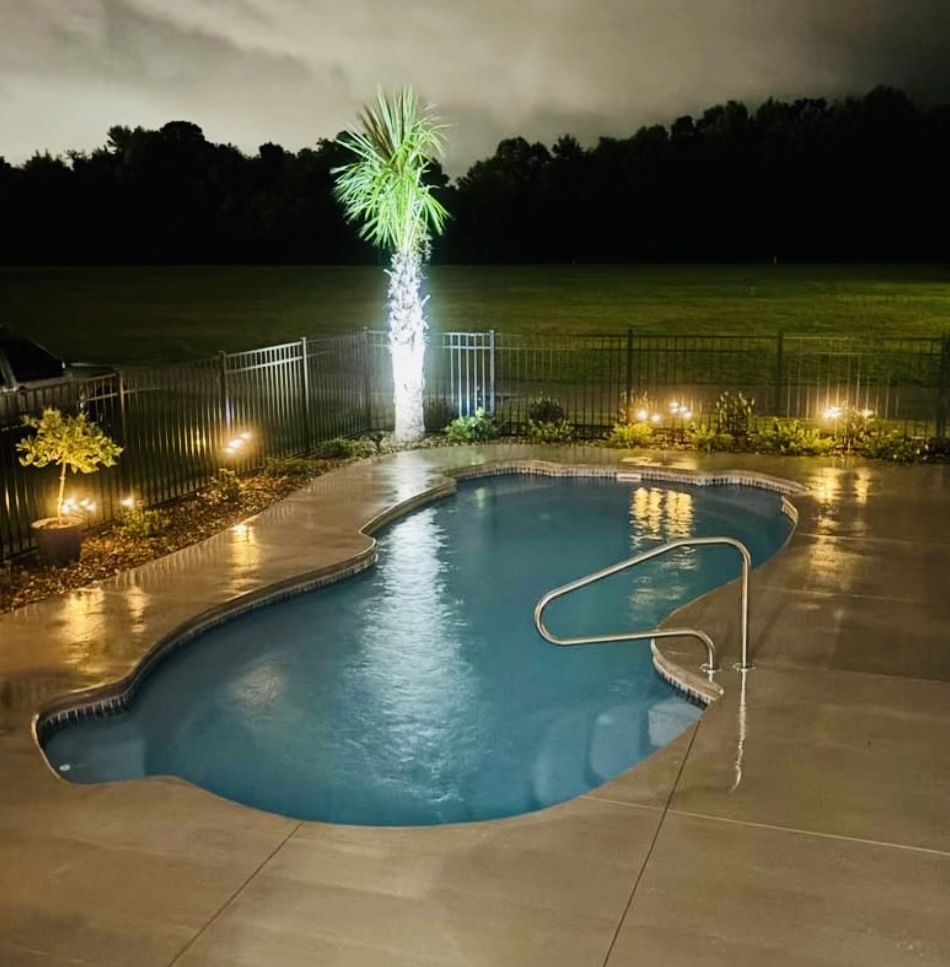 Roatan fiberglass pool installed in a backyard