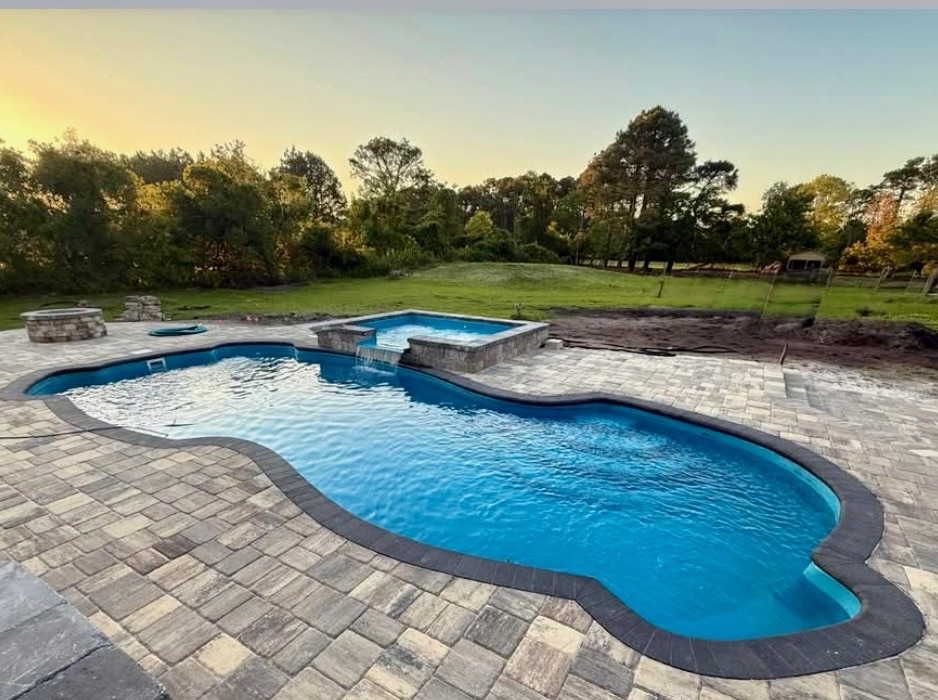 Fiberglass pool installed in a backyard