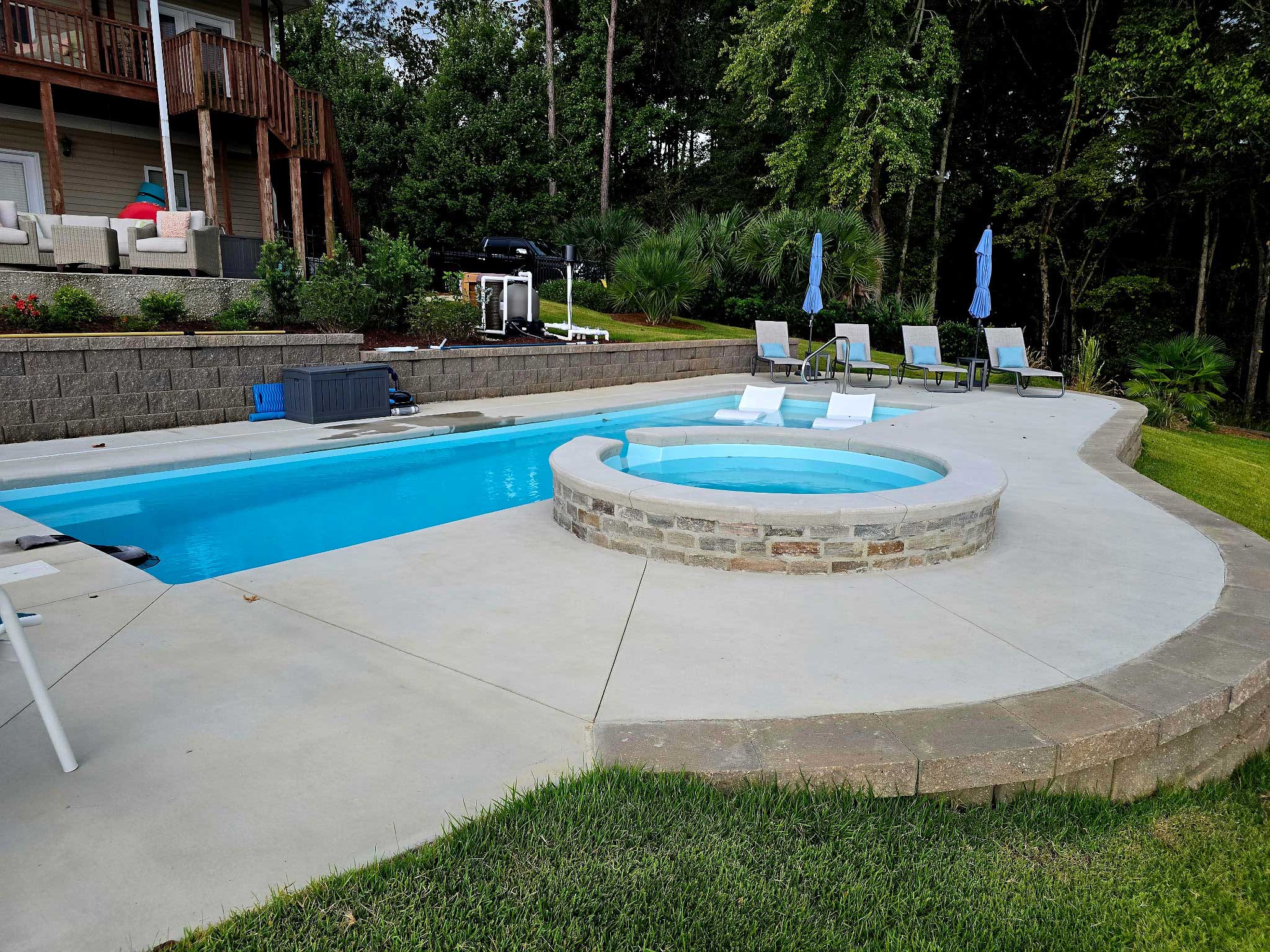 Retaining wall installed around pool